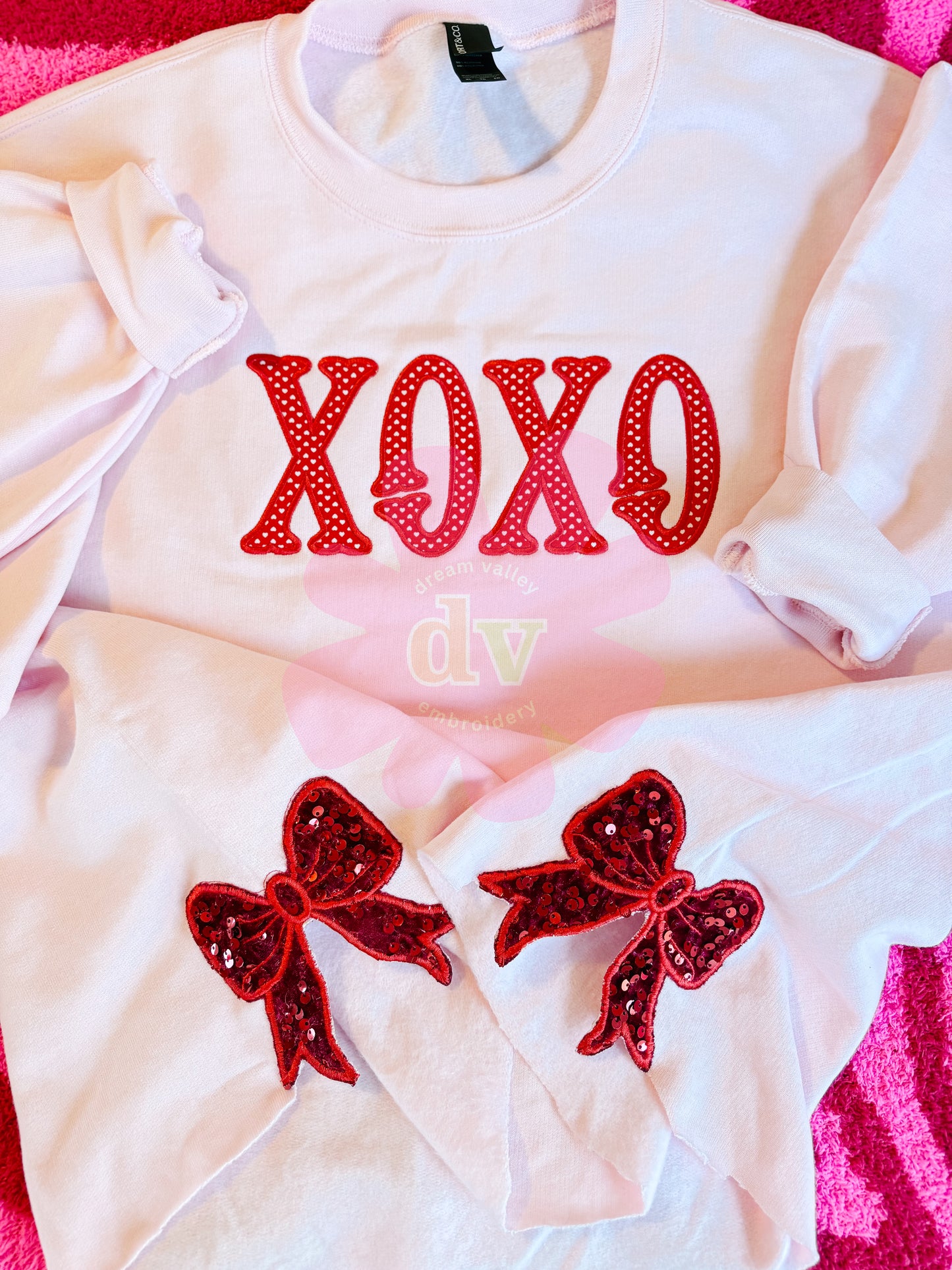 Light Pink XOXO applique sweatshirt with sparkle side bows
