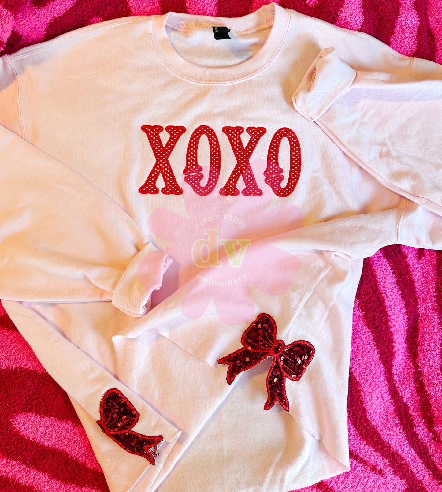 Light Pink XOXO applique sweatshirt with sparkle side bows