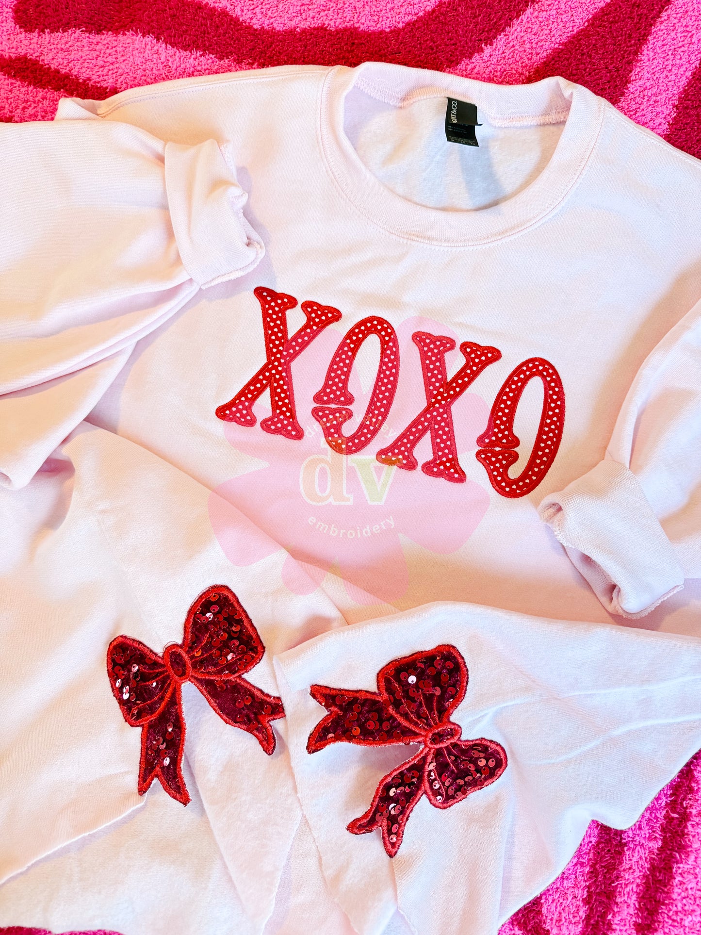 Light Pink XOXO applique sweatshirt with sparkle side bows